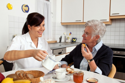 lady caregiver assisting the old woman