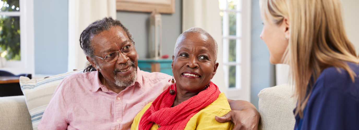 Female Support Worker Visits Senior Couple At Home